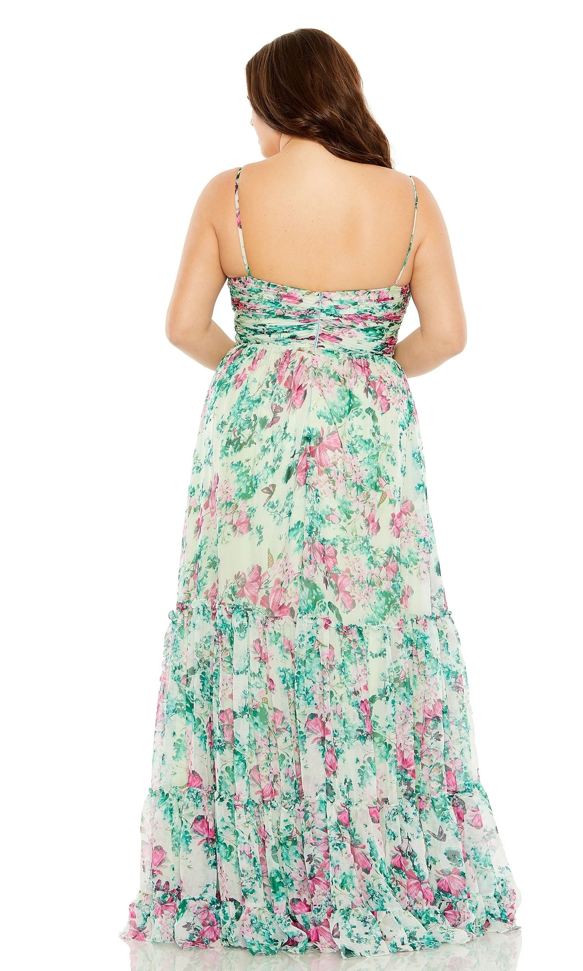 A woman is shown from the back against a white background wearing the Long Plus-Size Formal Dress 68550 by Mac Duggal—an a-line, green floral dress with thin straps.